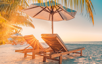 Two beach chairs under the sun